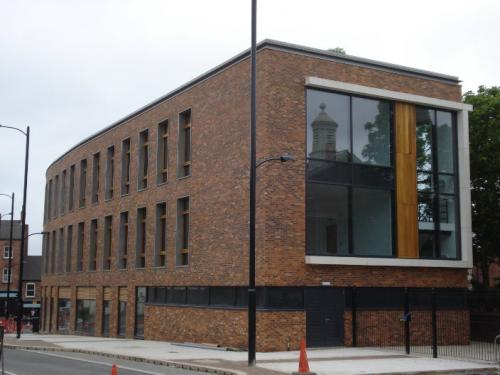 brick building with wooden cladding