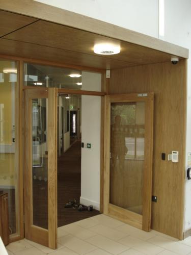 glass double doors with wooden frame