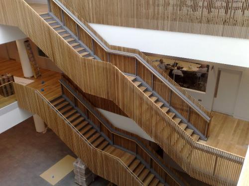 wooden staircase with cladding