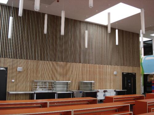 wooden cladding high ceiling with dangling lights