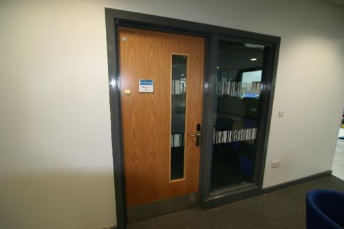 wooden door next to large window